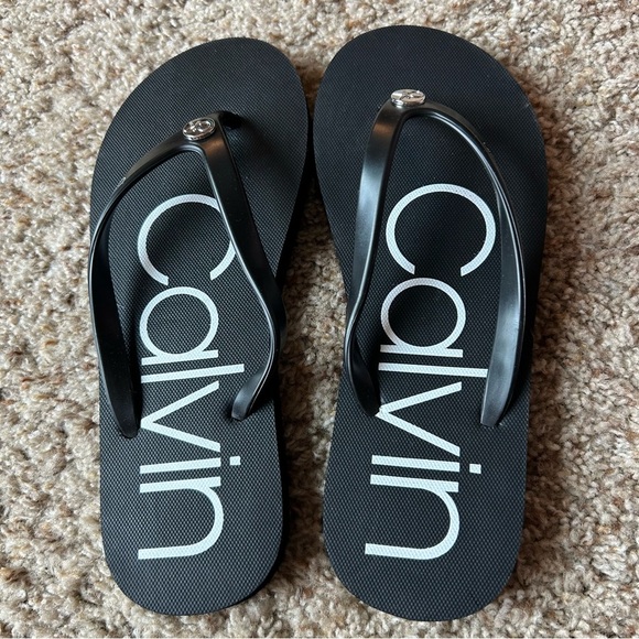 Calvin Klein Shoes - Calvin Klein Black Flip-Flop Sandals